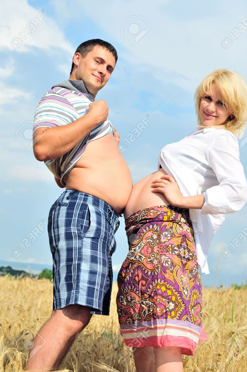 Funny Couple Touching Belly With Each Other