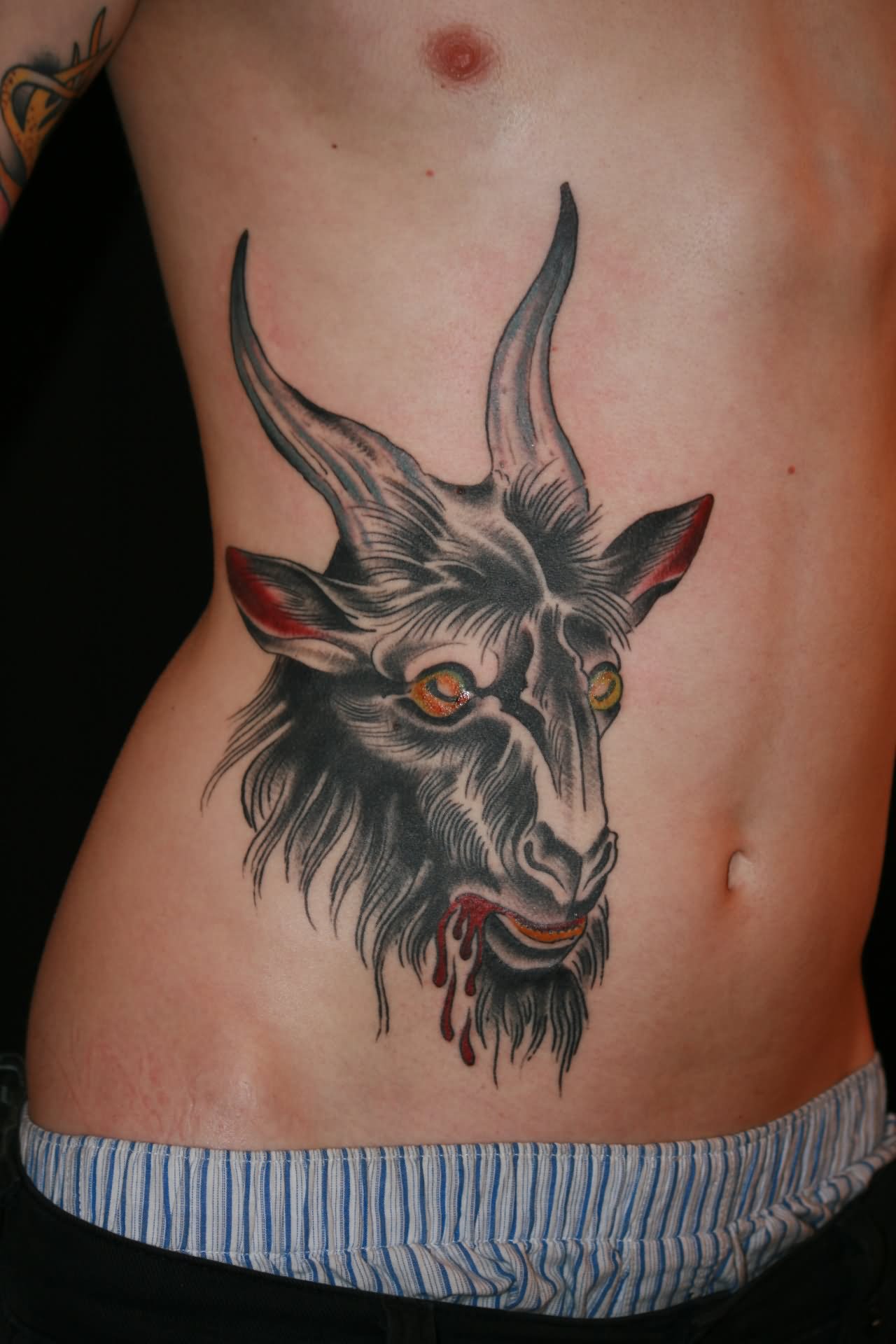 Goat Head Tattoo On Man Side Rib