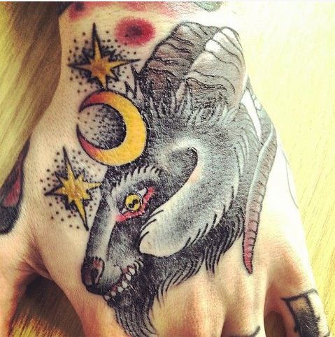 Goat Head With Half Moon And Stars Tattoo On Hand