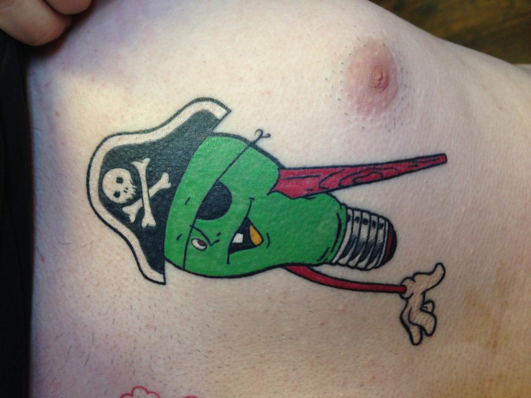 Green Pirate Skull Tattoo On Chest
