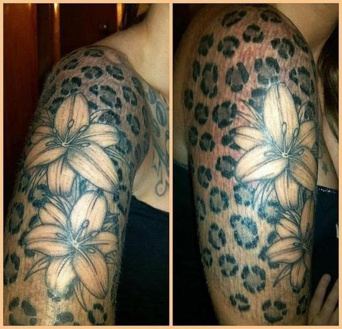 Grey Lily Flowers And Cheetah Print Tattoo On Half Sleeve