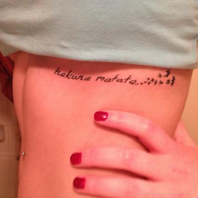 Hakuna Matata Lettering With Little Flyings Birds Tattoo On Under Breast