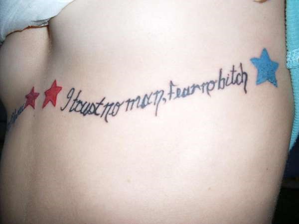 I Trust No Man, Fear No Bitch Lettering With Stars Tattoo On Under Breast