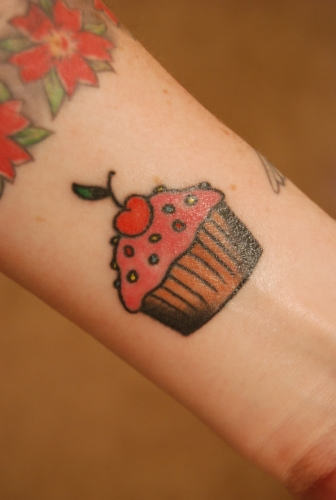 Impressive Cupcake Tattoo Design For Forearm