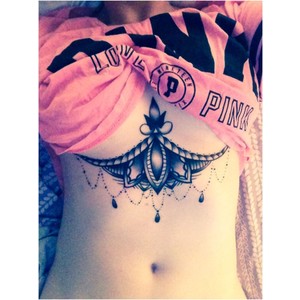 Impressive Design Tattoo On Under Breast