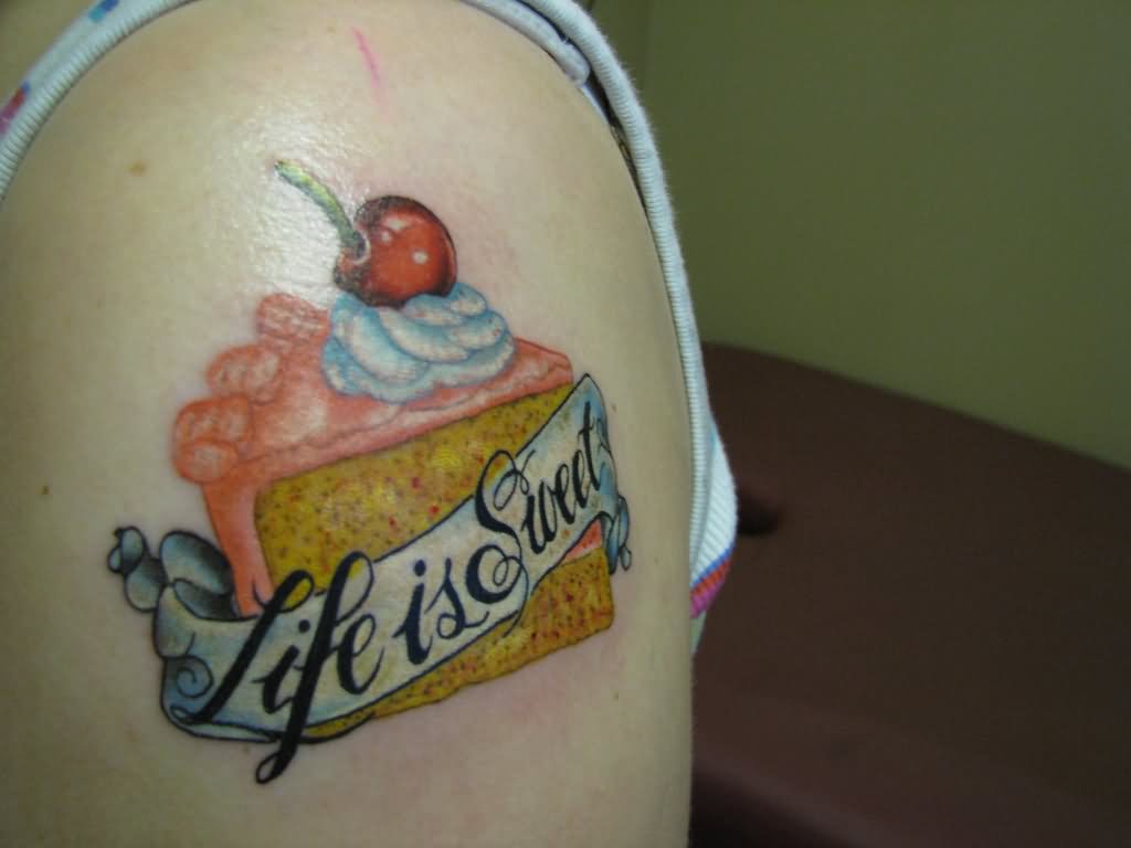 Inspiring Cake Piece With Banner Tattoo On Shoulder