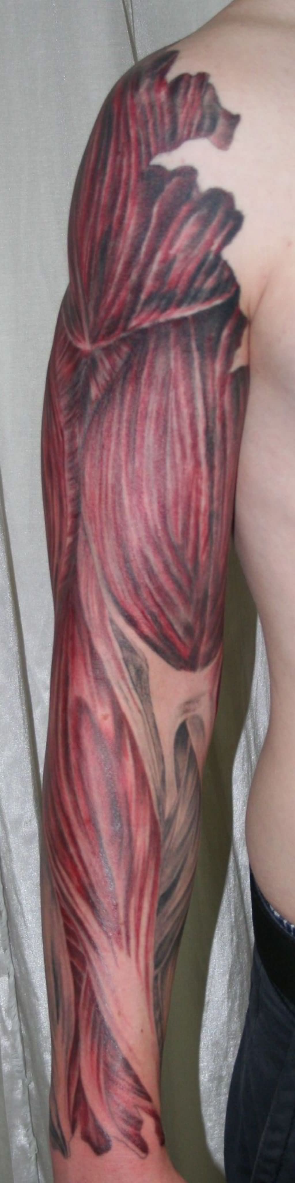 Inspiring Ripped Skin Muscle Tattoo On Full Sleeve