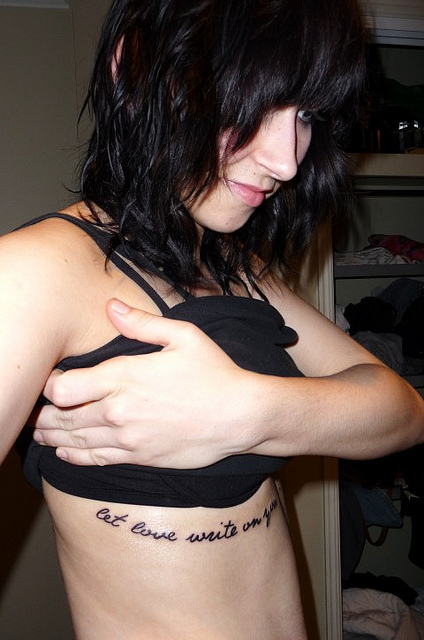 Let Love Write On You Lettering Tattoo On Under Breast