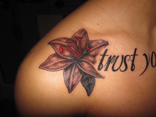 Lily Flowers And Trust Tattoo On Shoulder