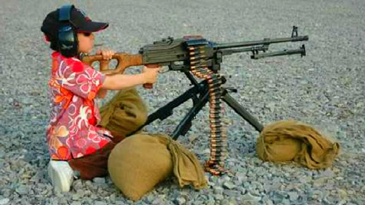 Little Boy Using Big Gun Funny Image
