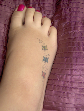 Little Butterflies Tattoo On Girl Foot