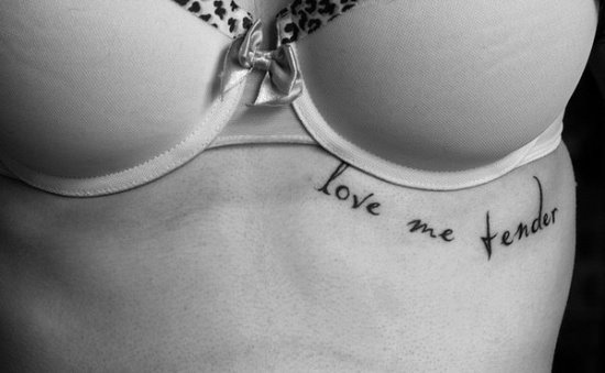 Love Me Tender Lettering Tattoo On Under Breast
