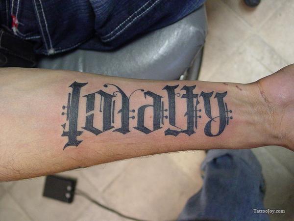 Loyalty Tattoo Black Ink Tattoo On Left Forearm