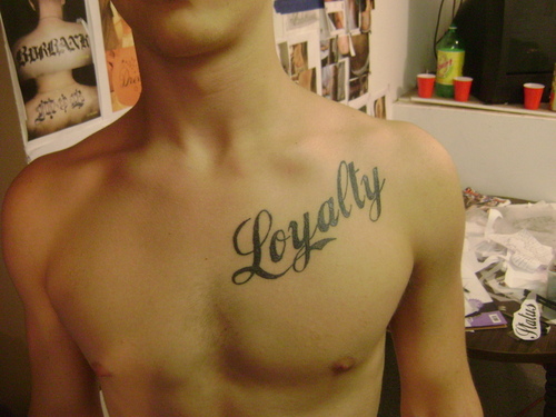 Chest Loyalty Before Royalty Tattoo