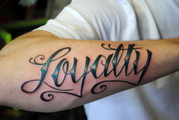 Loyalty Tattoo On Man Right Arm