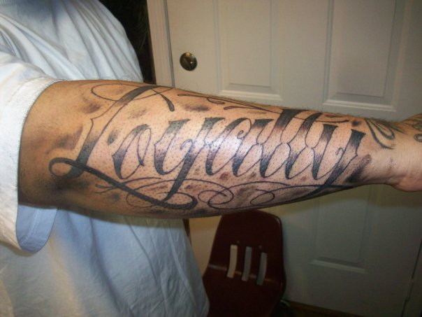 Loyalty Tattoo On Right Sleeve