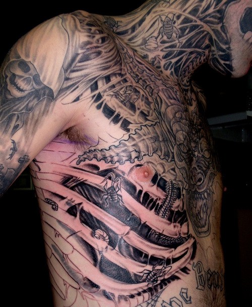 Man With Grey Ink Rib Cage And Muscles Tattoo On Full Body