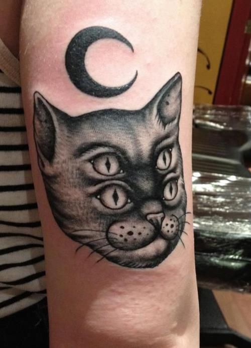 Moon And Doubled Eye Cat Head Tattoo On Bicep