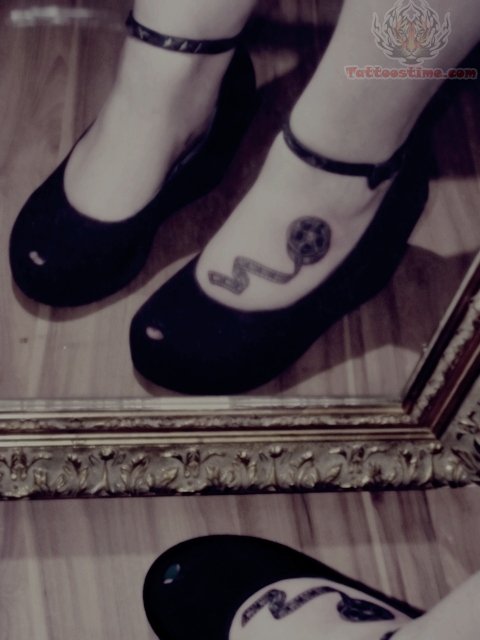 Movie Camera Reel Tattoo On Girl Foot