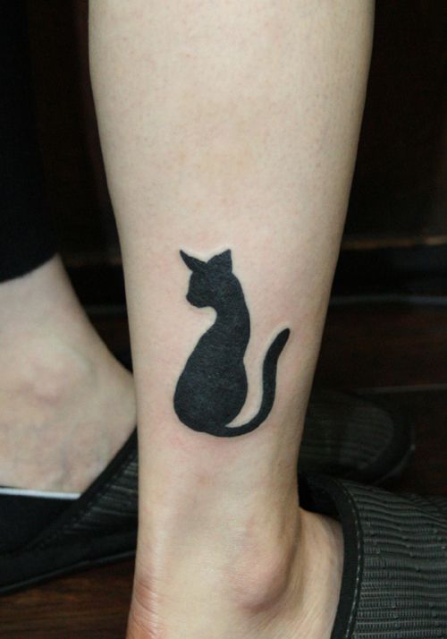 Nice Black Ink Cat Tattoo On Leg For Girls