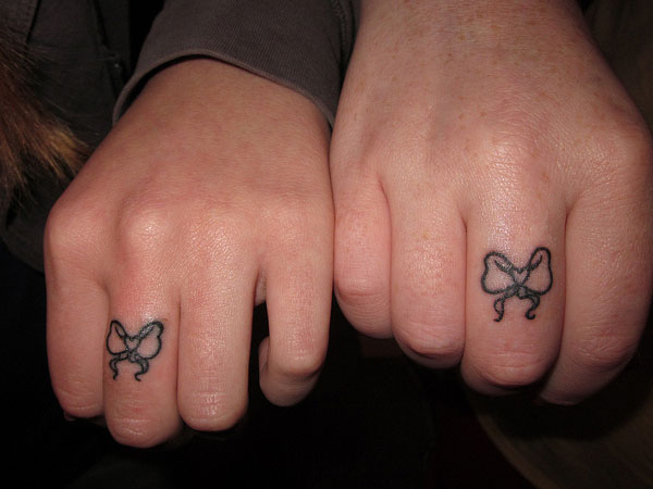Outline Bow Tattoos On Fingers
