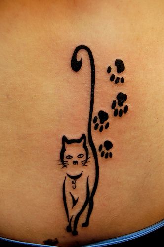 Paw Prints And Black Cat Tattoo On Lower Back