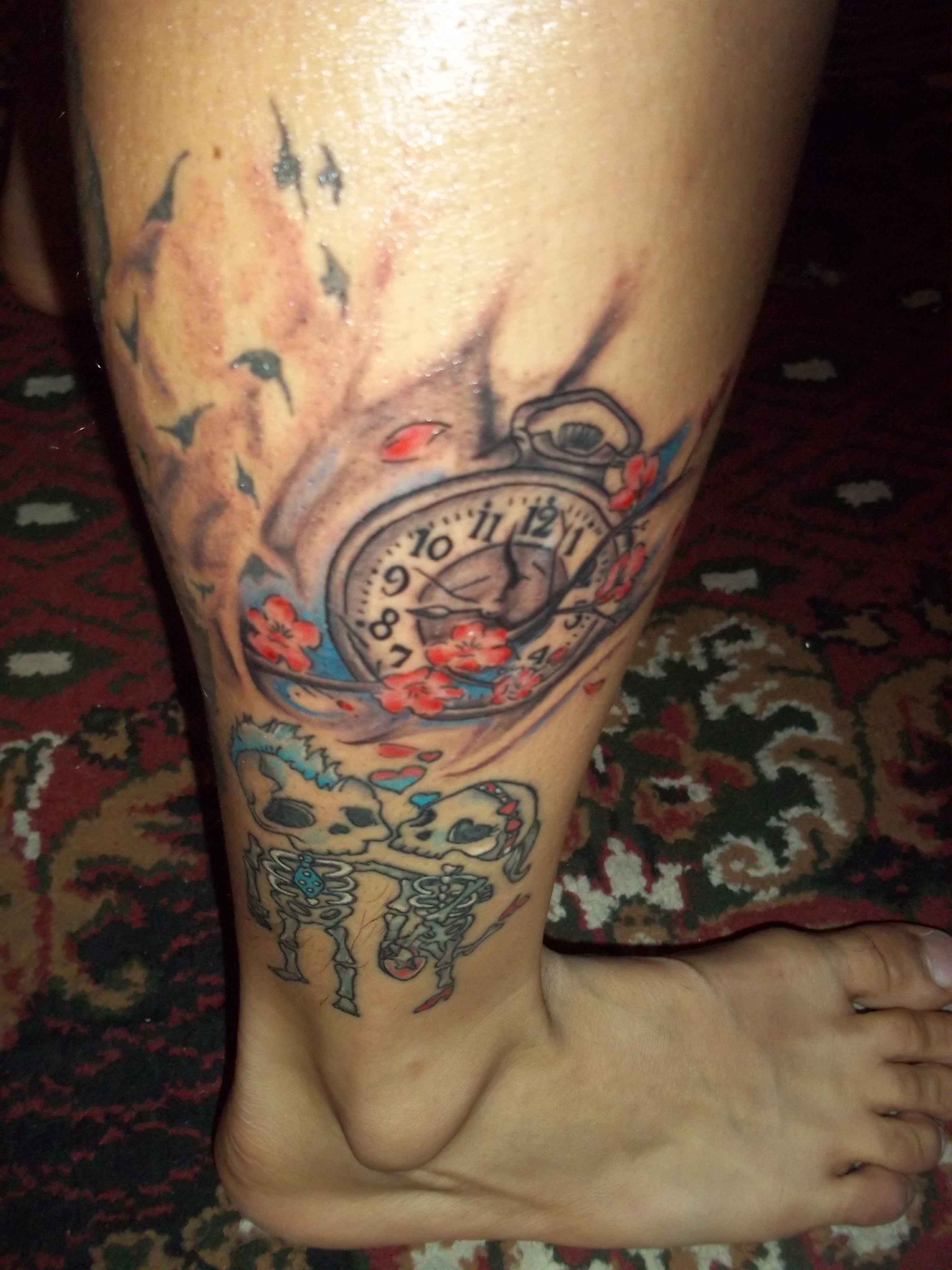 Pocket Watch With Flowers And Skeletons Tattoo On Leg