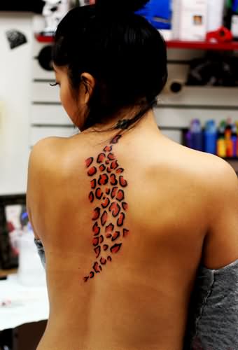 Red And Black Cheetah Print Tattoo On Back