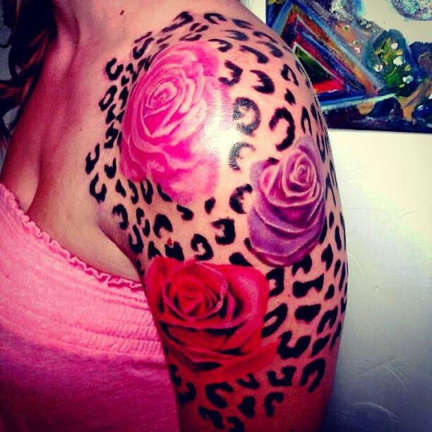 Red Rose Flowers And Cheetah Print Tattoo On Left Shoulder