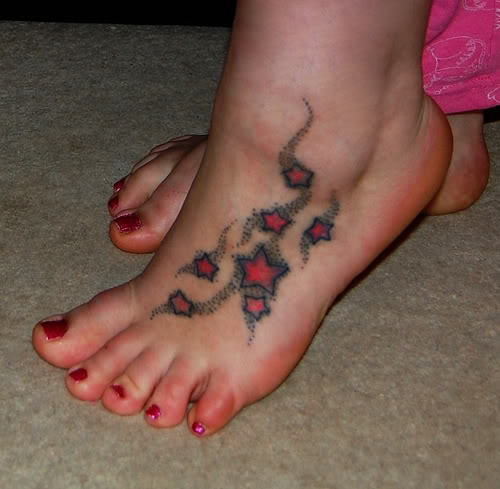 Red Stars Tattoo On Girl Foot