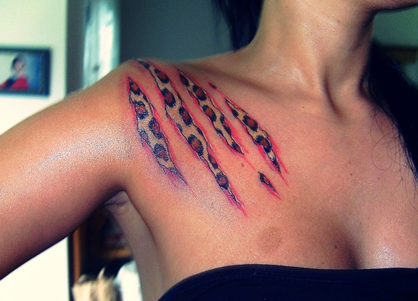 Ripped Skin Cheetah Tattoo On Girl Right Shoulder