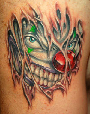 Ripped Skin Clown Head Tattoo Design