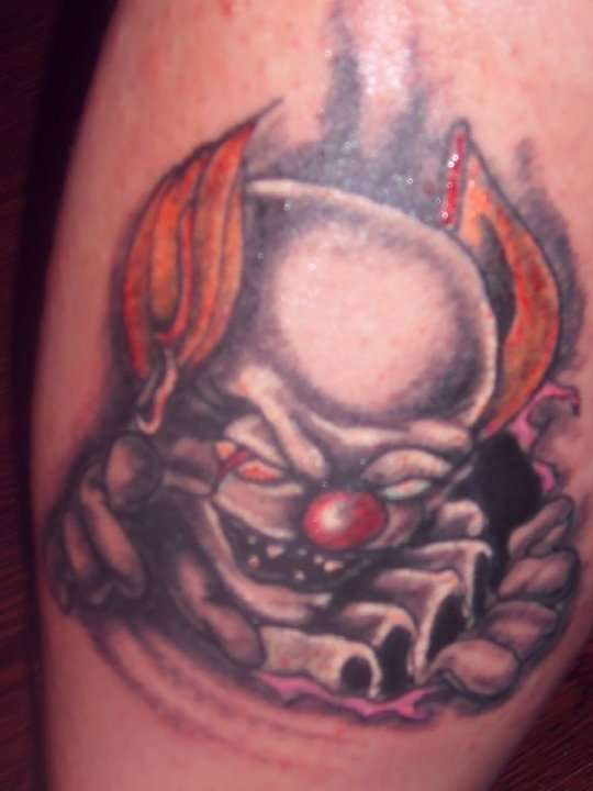 Ripped Skin Clown Tattoo Design