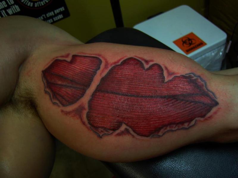 Ripped Skin Muscle Tattoo Design For Bicep