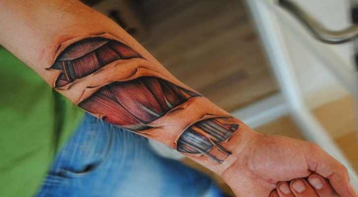 Ripped Skin Muscle Tattoo On Forearm