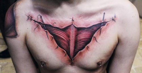 Ripped Skin Muscle Tattoo On Man Chest