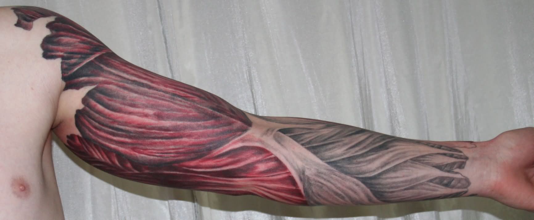 Ripped Skin Muscle Tattoo On Man Left Full Sleeve