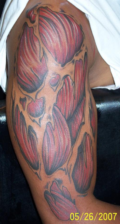 Ripped Skin Muscle Tattoo On Right Half Sleeve