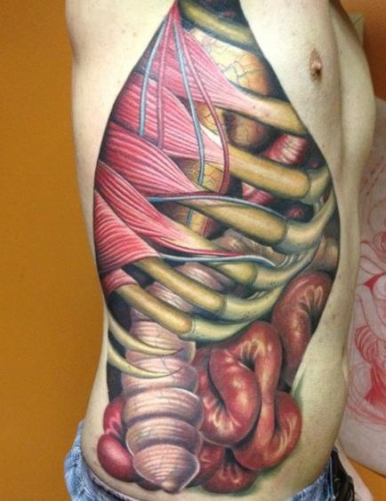 Ripped Skin Rib Cage And Muscle Tattoo On Man Side Rib