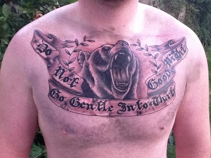 Roaring Bear Head With Banner Tattoo On Man Chest