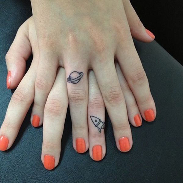 Rocket And Planet Tattoos On Fingers