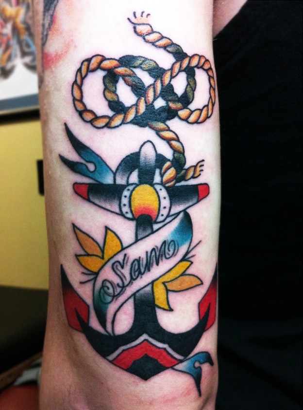 Sam Banner And Anchor Tattoo On Half Sleeve