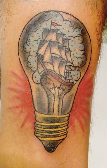 Ship In Bulb Tattoo On Inner Bicep