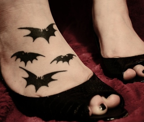 Silhouette Four Bats Tattoo On Girl Foot