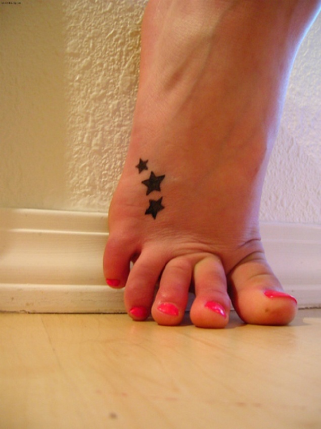 Silhouette Three Stars Tattoo On Girl Foot