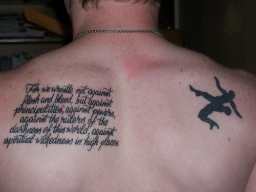 Silhouette Two Wrestler Fighting With Quote Tattoo On Back Shoulder.