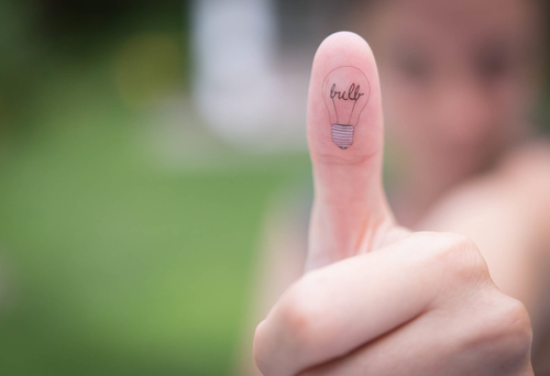 Small Bulb Tattoo On Thumb