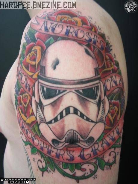 Star War Soldier Mask With Roses And Banner Tattoo On Man Left Shoulder