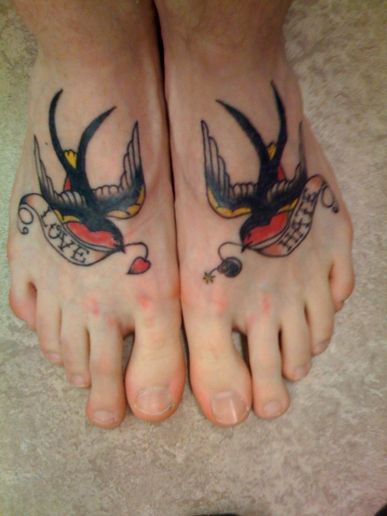 Traditional Two Birds With Banner Tattoo On Feet