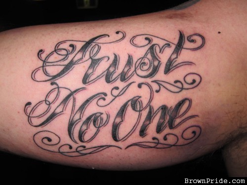 Trust No One Tattoo On Inner Bicep